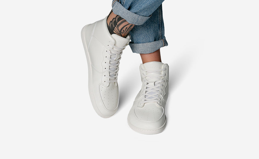 Model wearing the Courtside Mid All White
